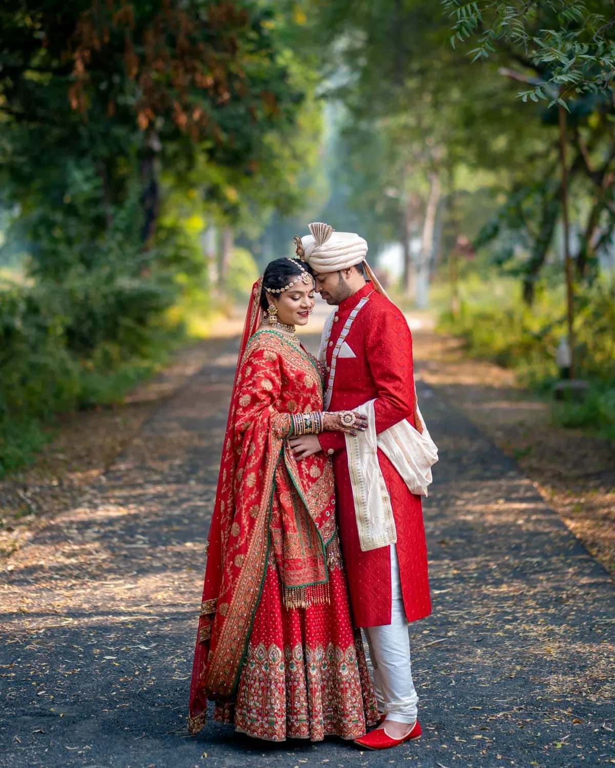 The couple walking together through the trees