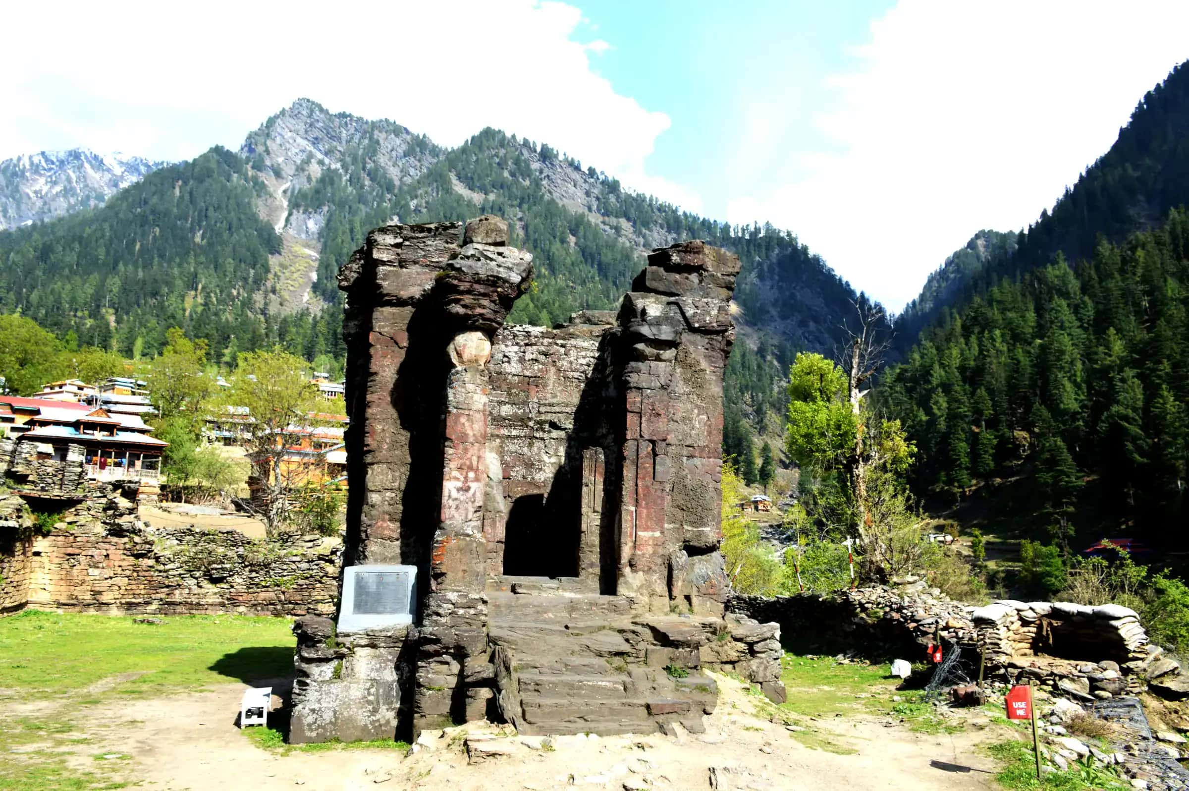 The stone ruins of the old university at Sharda below snowy ridges