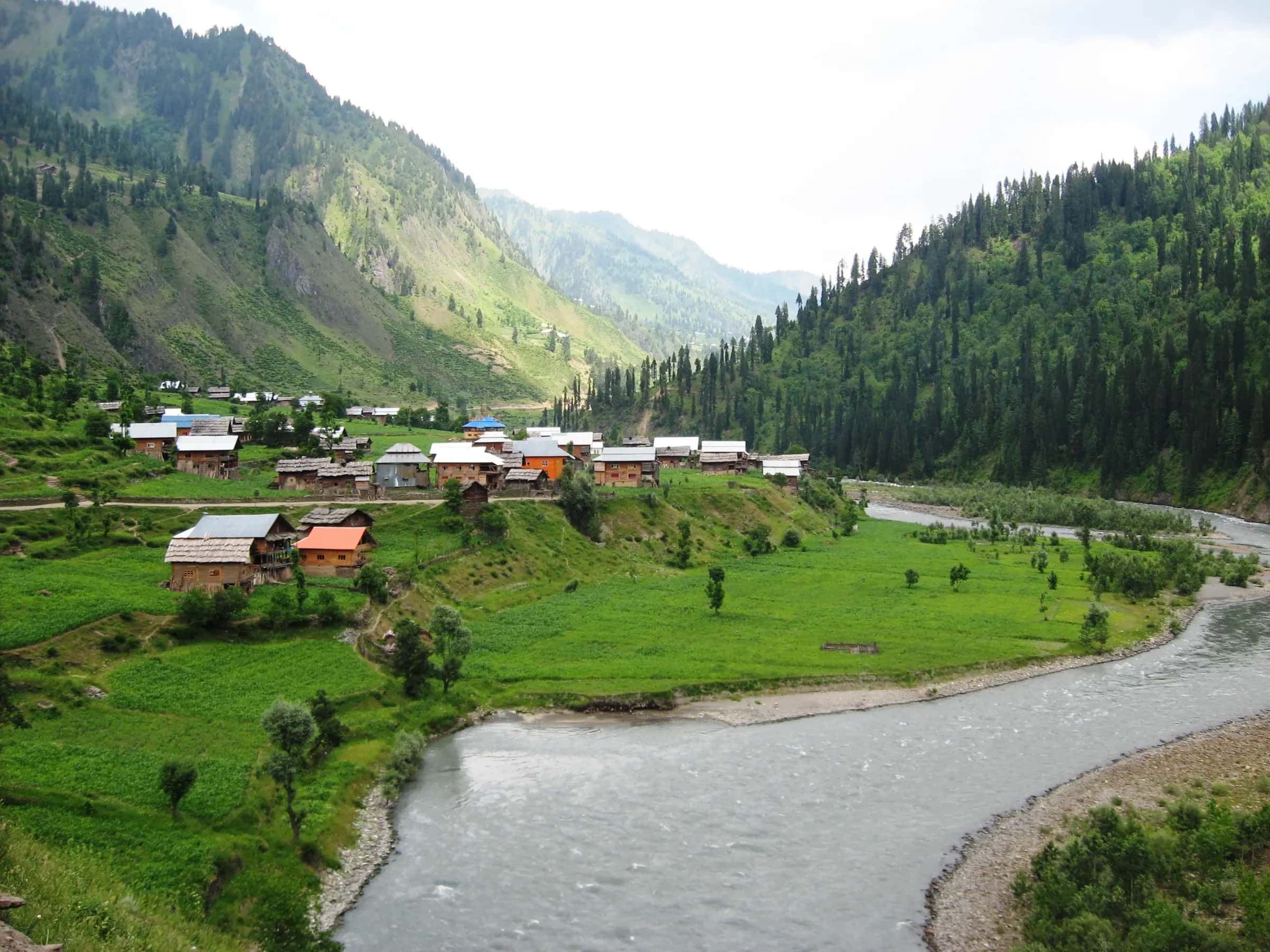 The last village, Taobat, its wooden houses by the river under the mountains