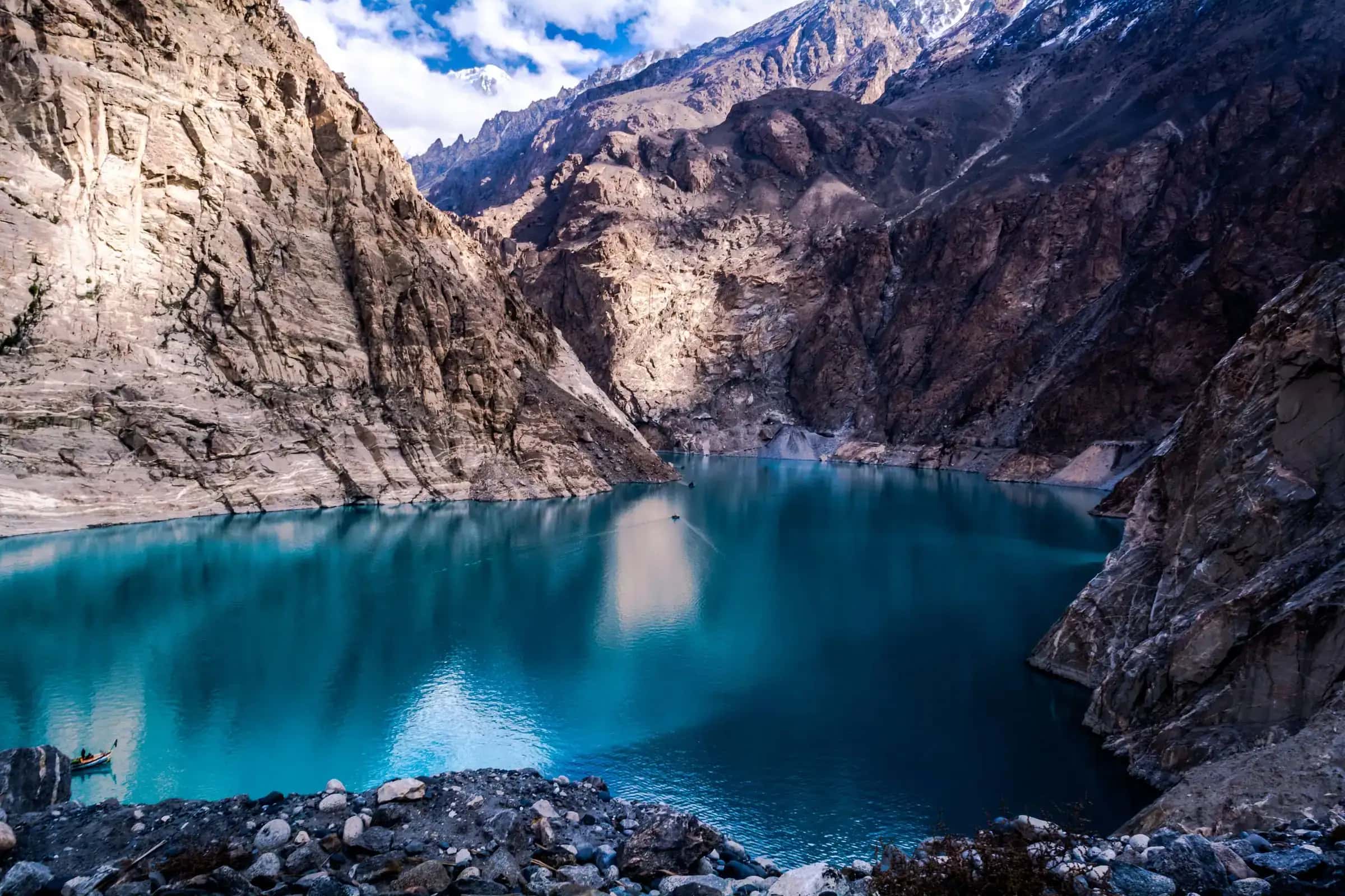 Attabad lake's blue water between the cliffs