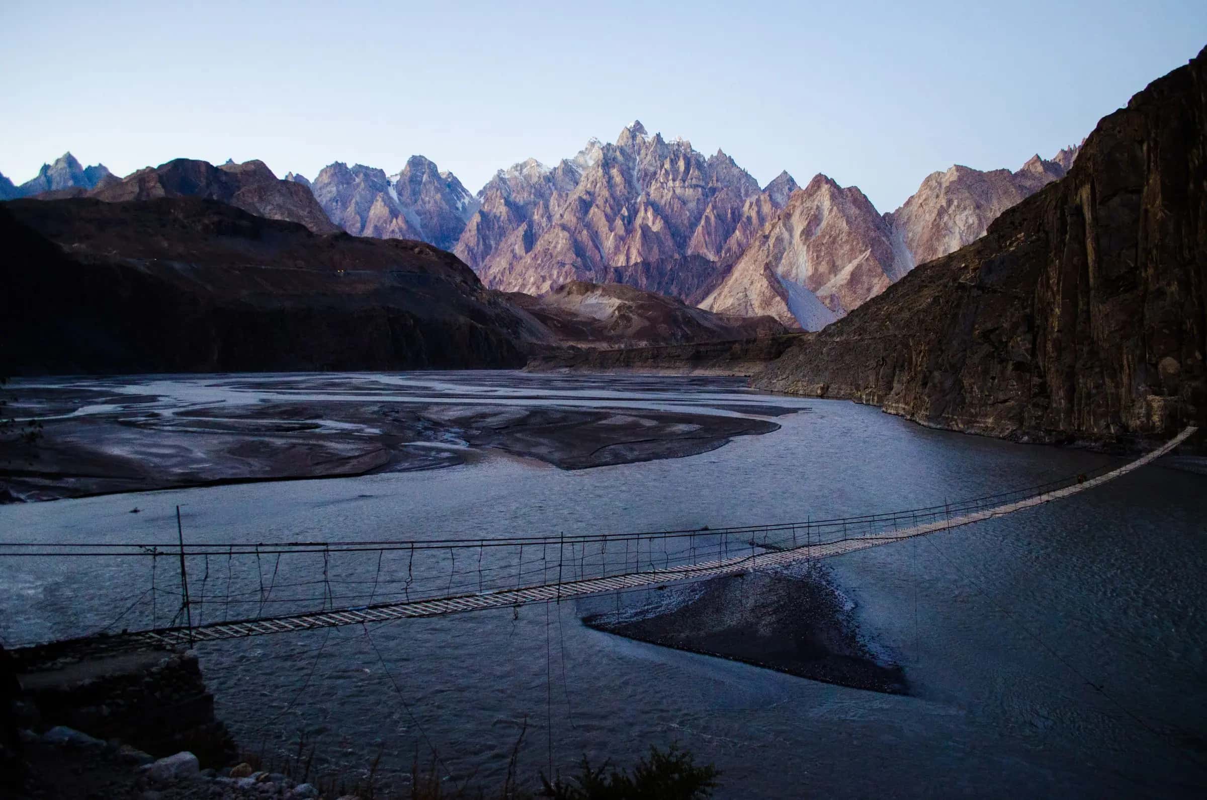 The Hussaini suspension bridge over the Hunza river, the Passu cones behind