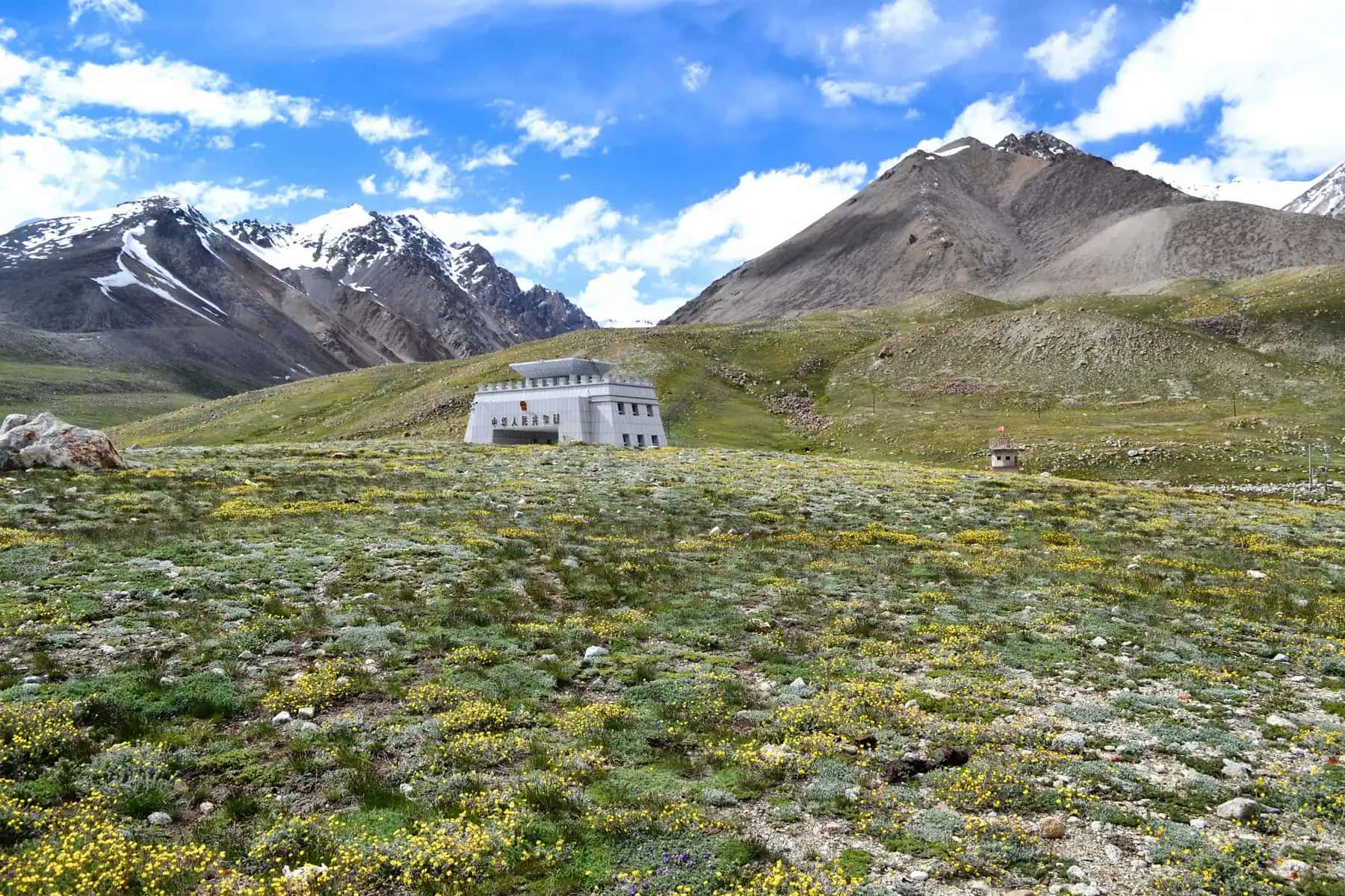 Snow peaks over the high meadows on the way to Khunjerab