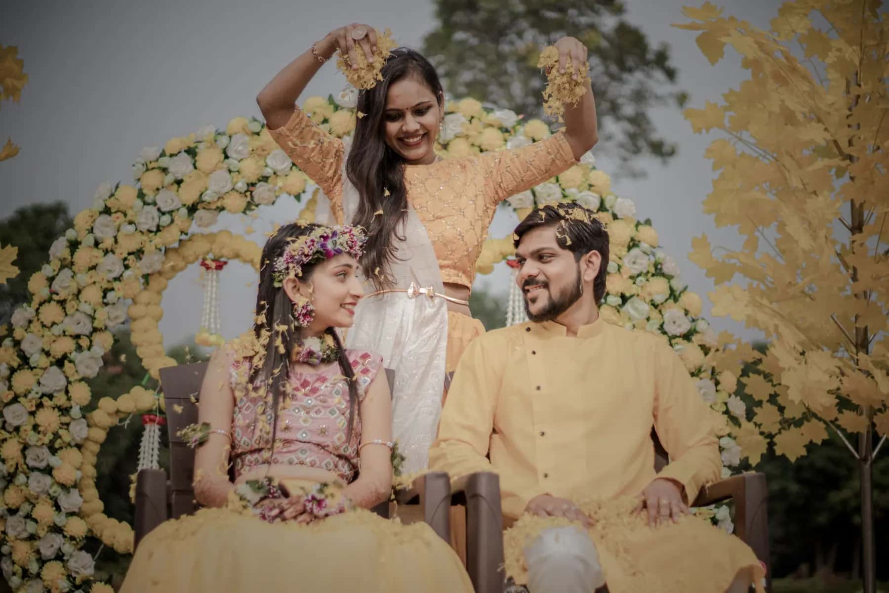 Petals thrown over the couple as they sit together