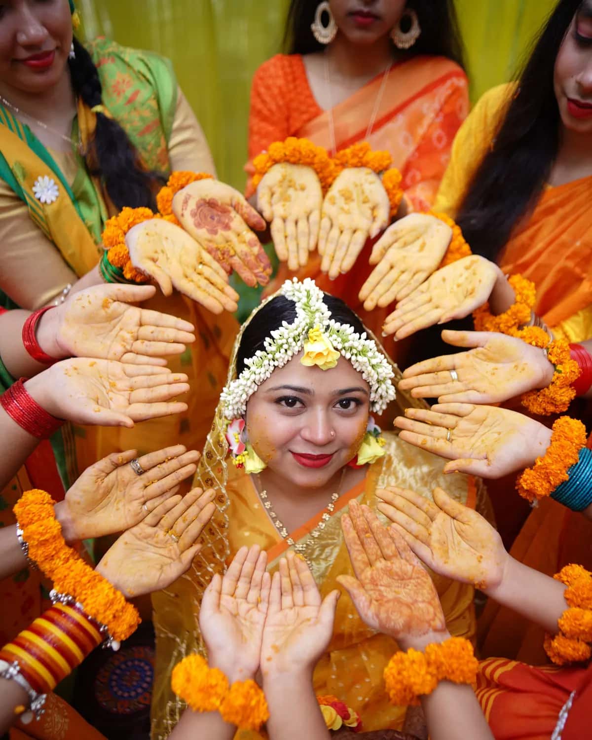 The bride framed by a circle of hennaed hands